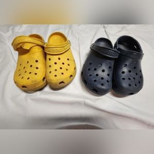 Two pair of 9-11 Size crocs unisex.